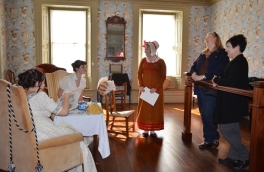 Visitors from New York meet the ladies and mantua maker
